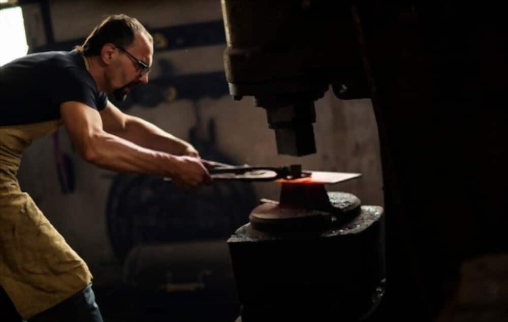 Experienced blacksmith working