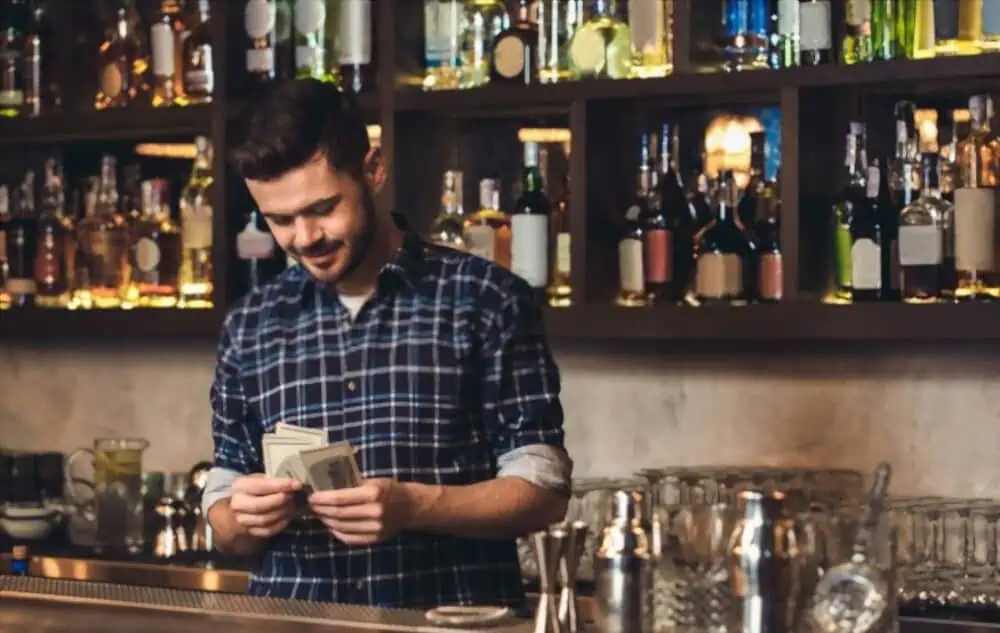 Bartender counting money