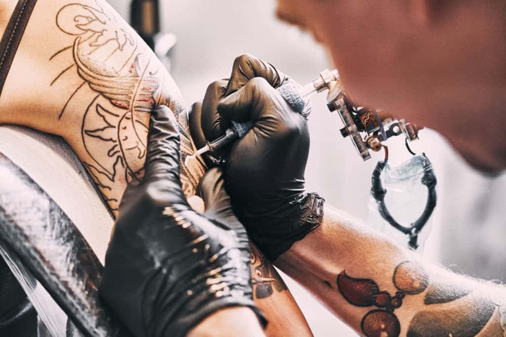 artist making a tattoo